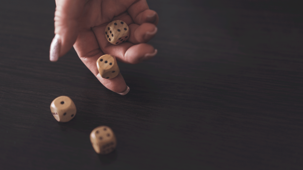 people playing dice on a table