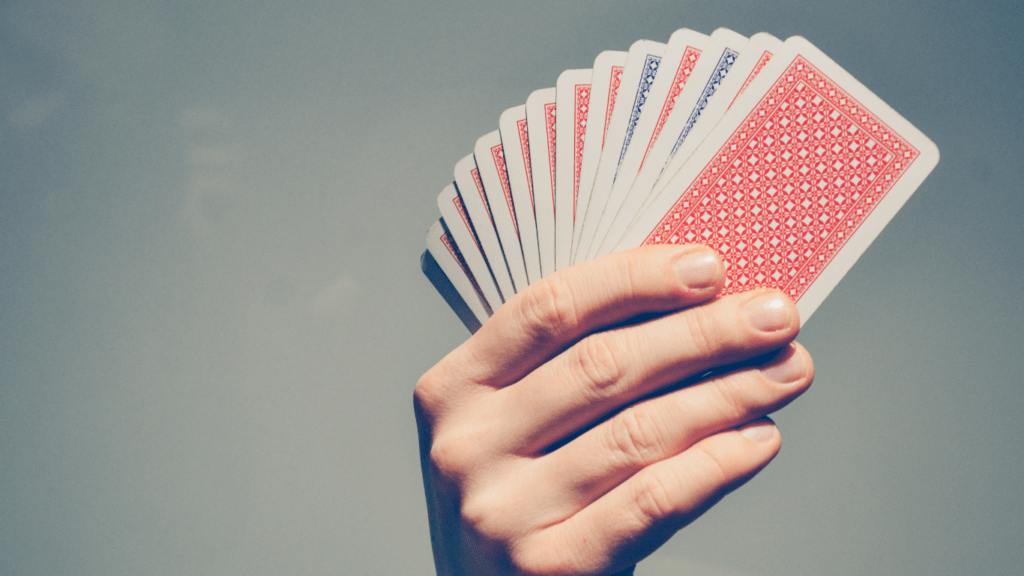 person holding a playing card