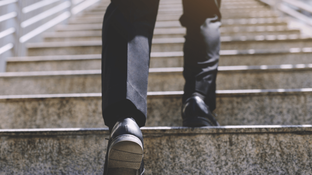 person walking up a set of stairs