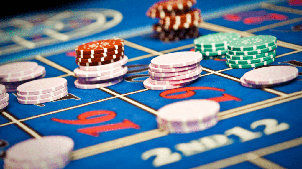 an image of a casino table with chips and roulettes