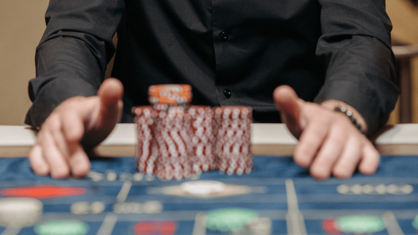 man arranging his casino tokens