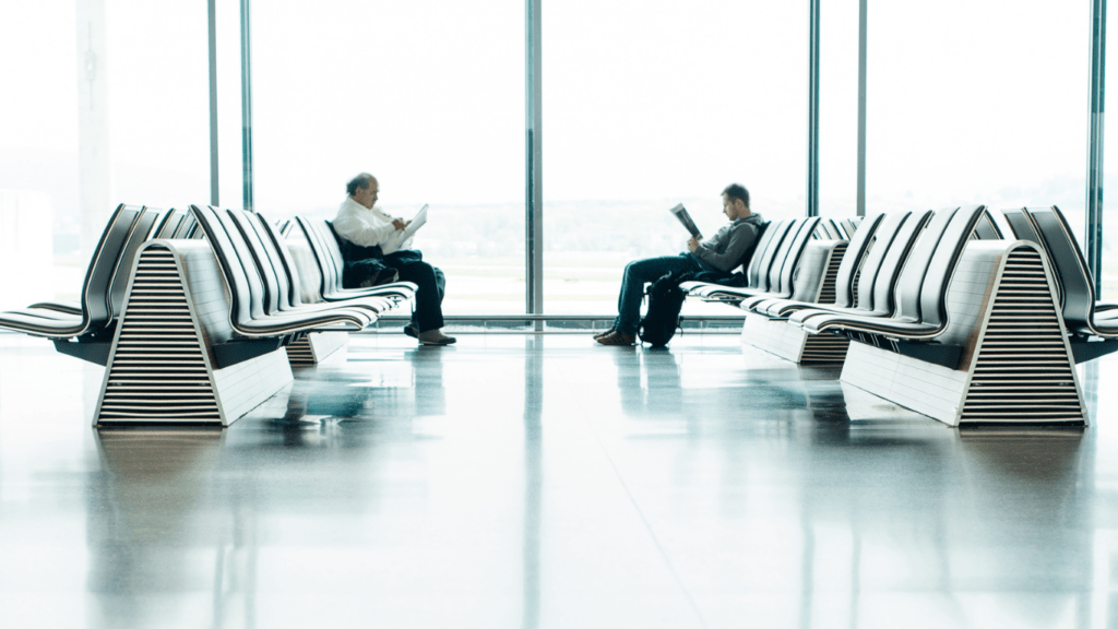 Two people sitting in chairs talking to each other