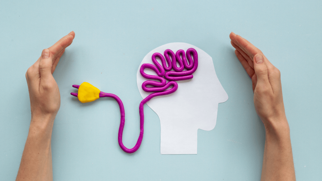 a human brain with electrical plug