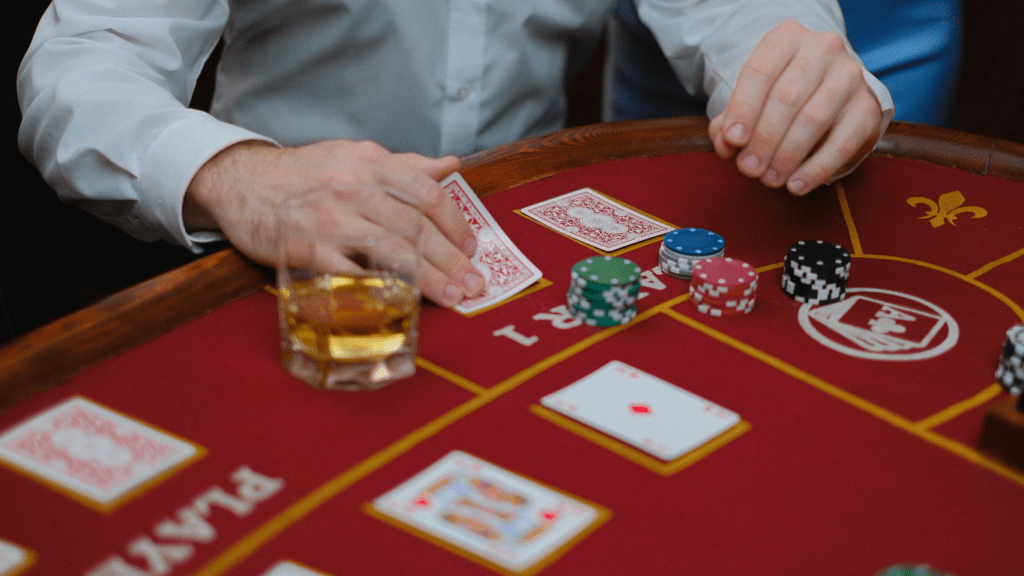 a casino table with several people playing blackjack