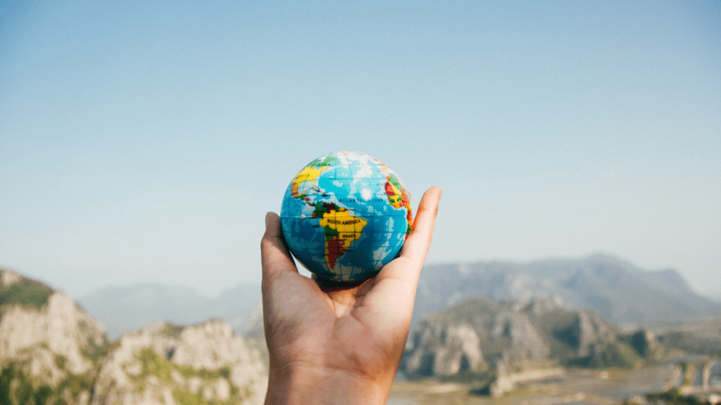 a child holding a globe in their hands