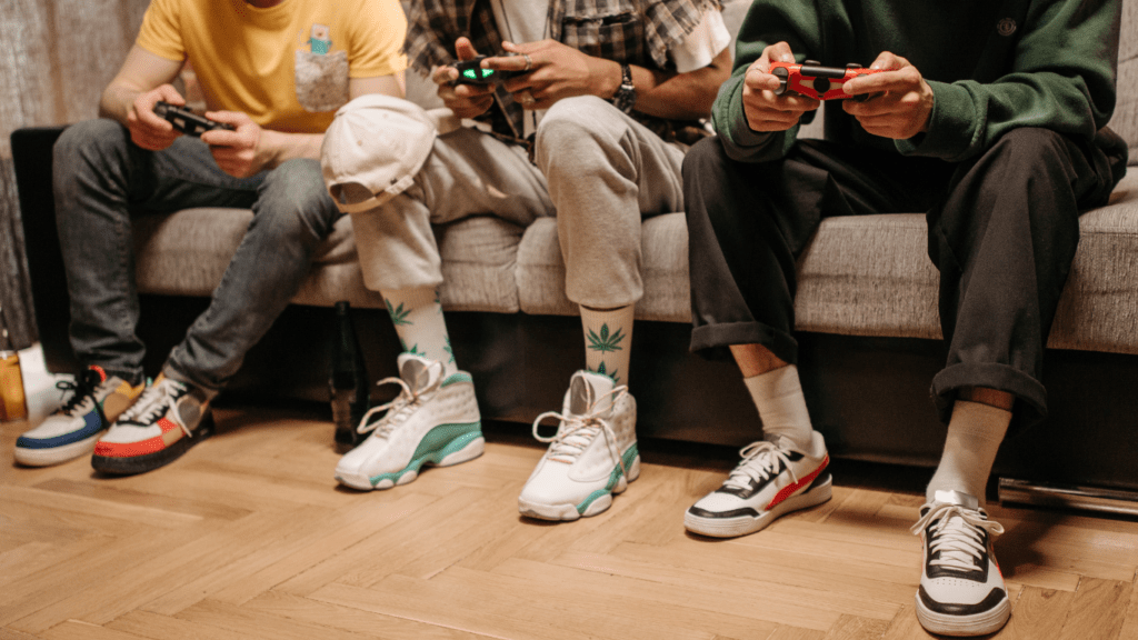 a group of people sitting on the floor playing video games