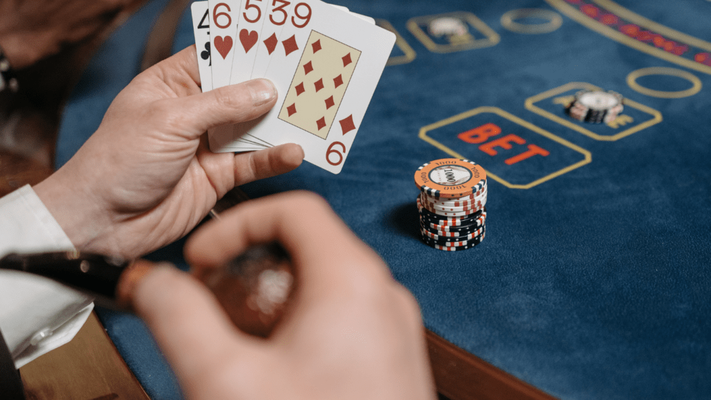 a person playing blackjack on a casino table