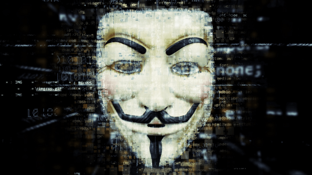 anonymous mask in front of a computer screen