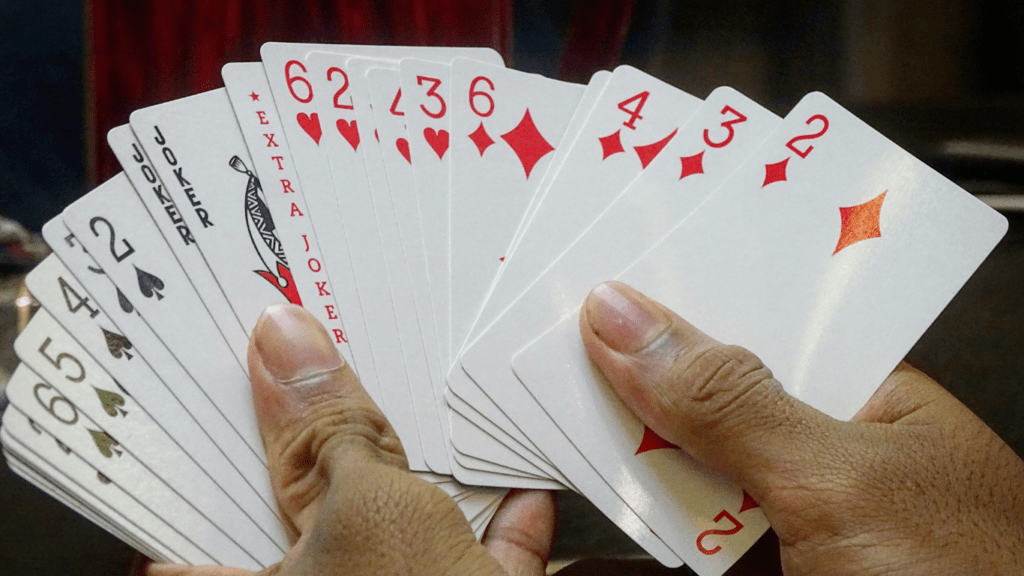 person holding a playing card