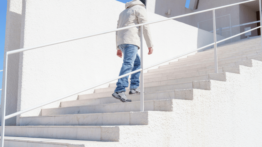 person walking up a set of stairs