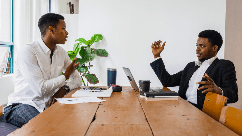 two people talking to each other in a living room