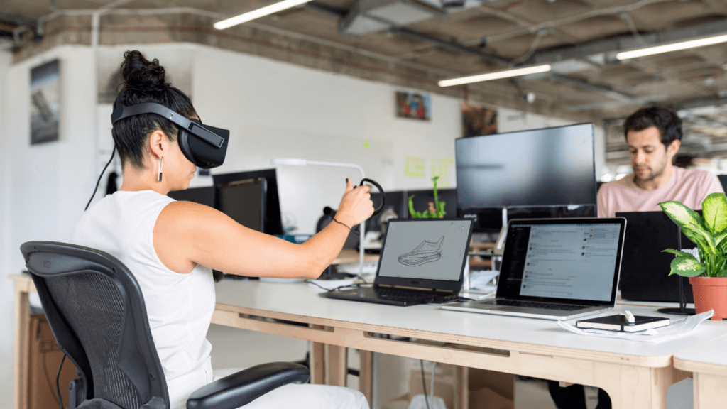 two people wearing virtual reality headsets in a room